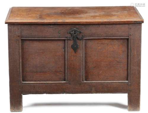A small oak coffer, the later hinged top revealing…