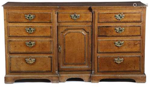 A George III oak inverted breakfront dresser, with…