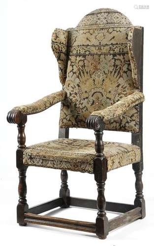 A rare late 17th century upholstered walnut wing a…