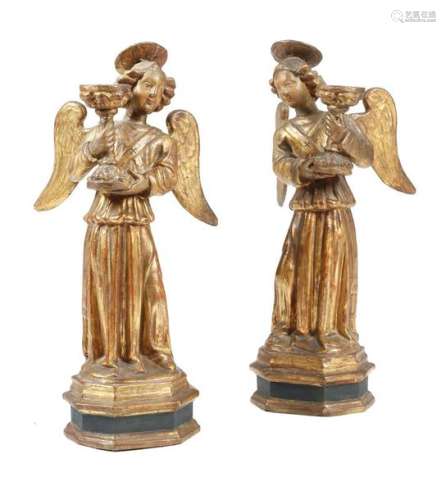 A pair of Italian gilt and painted terracotta ange…