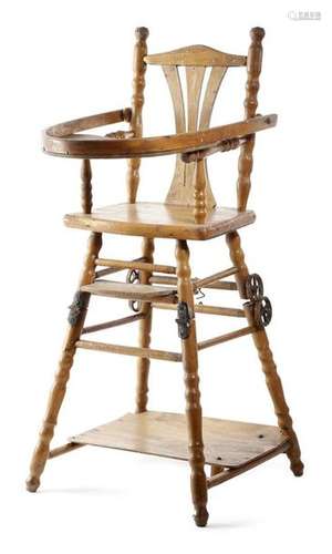 An early 20th century beechwood child's highchair,…