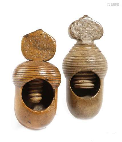 Two treen acorn screw action nutcrackers, one poss…