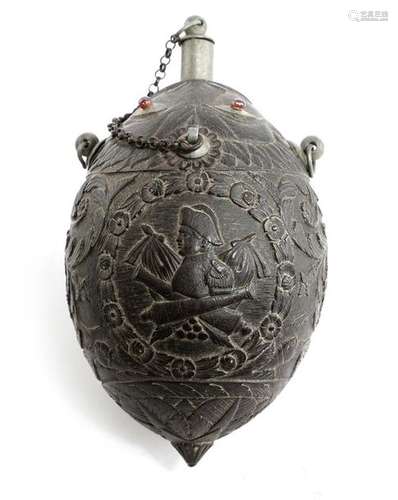 A carved coconut bugbear flask, with pewter fittin…