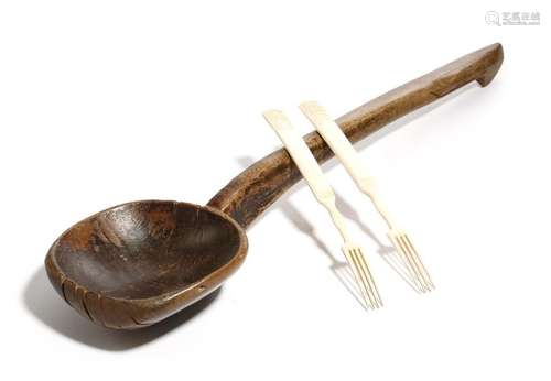 A 19th century treen wooden ladle, together with a…