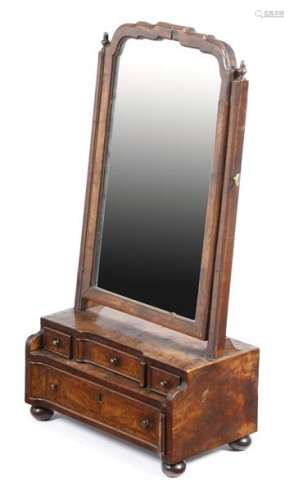 A George I walnut dressing table mirror, with feat…