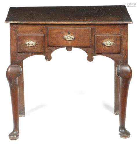 An early 18th century oak lowboy, fitted with thre…