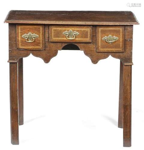 A George II oak lowboy, with ash feather banding, …