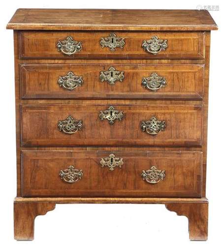 A George II walnut chest, the quarter veneered cro…