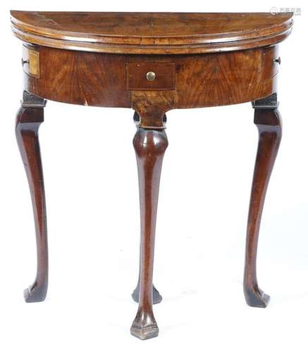 A small George II walnut demi lune card table, the…