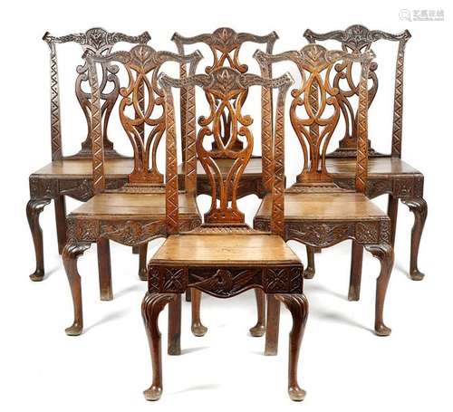 A set of six George III oak side chairs, each late…