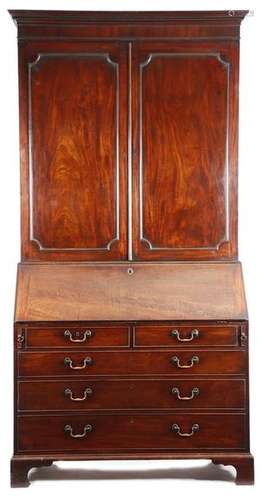 A George III mahogany bureau cabinet, with a denti…