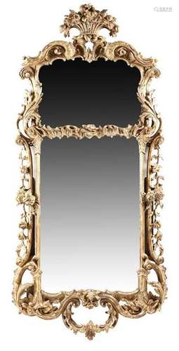 A George III giltwood wall mirror in the manner of…