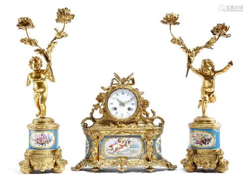 An ormolu and porcelain mounted clock garniture in…