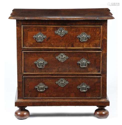 A Dutch burr yew and walnut chest, the shaped top …