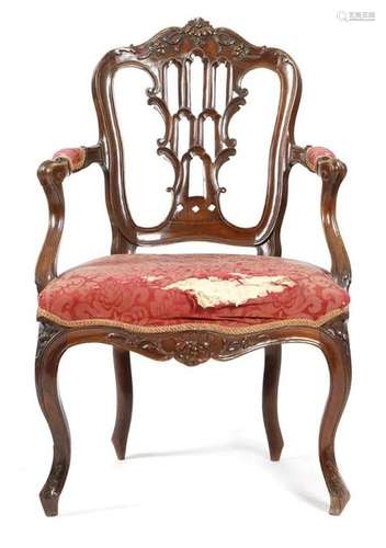 Λ An 18th century rosewood fauteuil in Louis XV st…