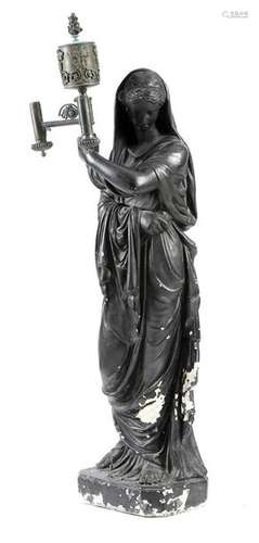 A Regency bronzed plaster figural torchere in the …