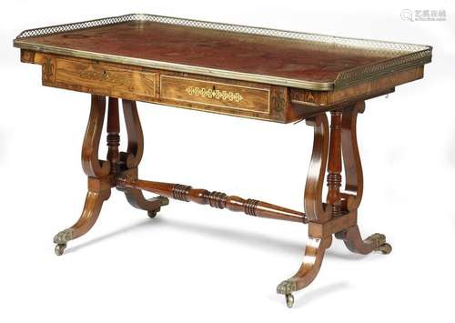 Λ A rosewood and brass mounted writing table, the …