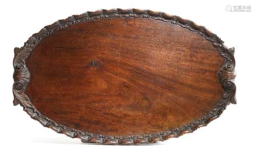 A late 19th century mahogany oval tray in Chippend…