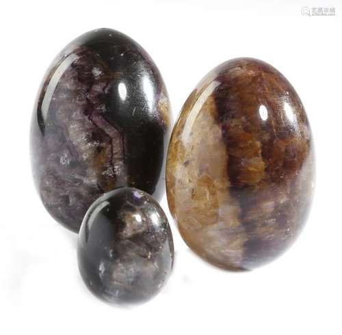 Two Derbyshire carved blue john specimen eggs, tog…