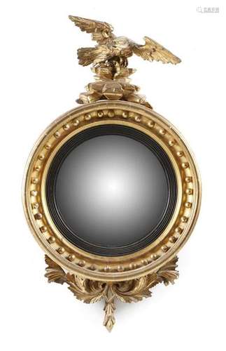 A Regency giltwood convex wall mirror by Thomas Fe…