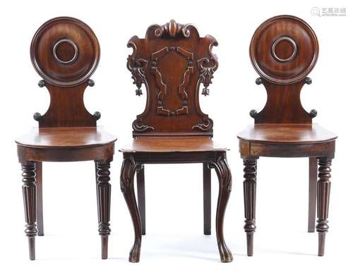 A pair of Regency mahogany hall chairs, each with …