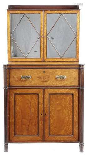 A Regency satinwood secretaire cabinet in the mann…