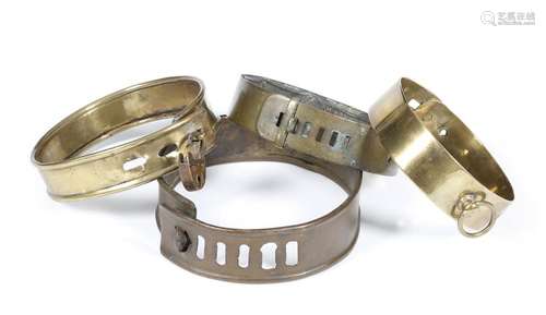 Four brass dog collars, one indistinctly inscribed…