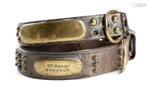 Two Victorian leather dog collars, each with brass…