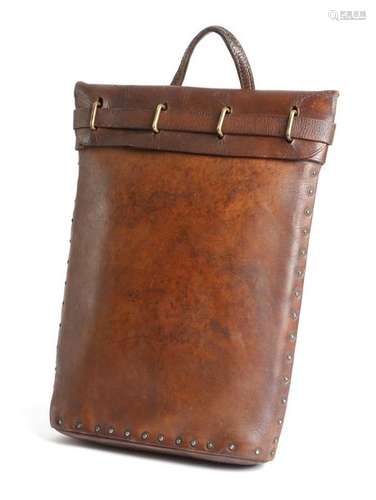 A brown leather briefcase, with brass fittings and…