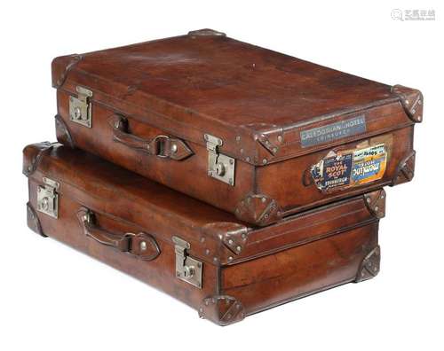 A matched pair of Scottish brown leather suitcases…