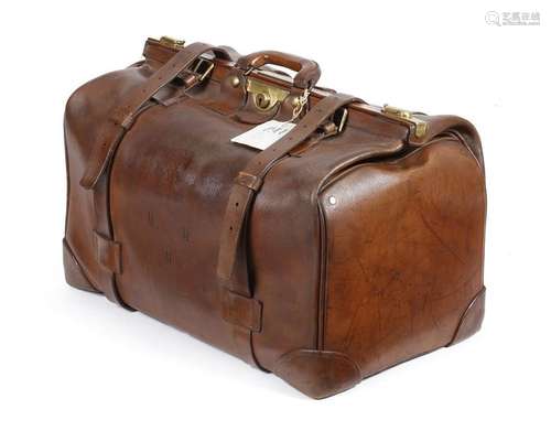 A large brown leather Gladstone bag, stamped with …