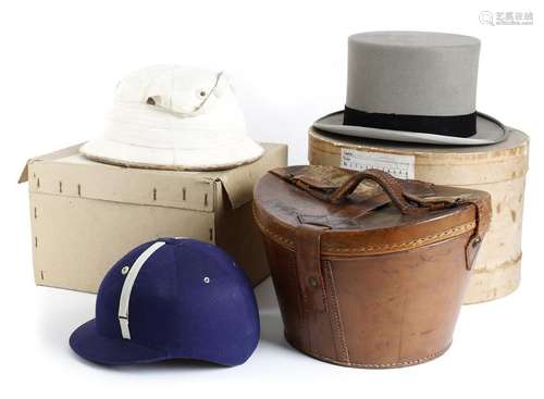 A brown leather bucket shaped hat box, together wi…