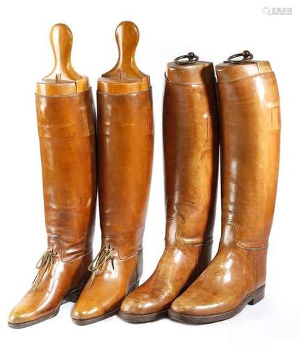 Two pairs of tan leather riding boots, both with w…