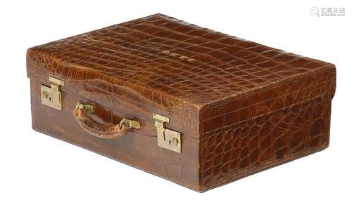 An early 20th century brown crocodile leather vani…