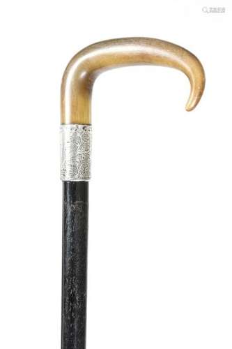 Λ A late Victorian horn handled walking cane, the …