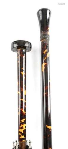 Λ A tortoiseshell walking cane, with a gilt metal …