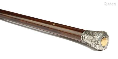 Λ A Victorian walking cane, the silver coloured me…