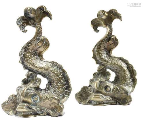 A pair of Victorian brass dolphin doorstops, 36.4c…