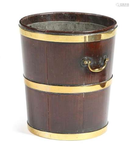 A George III mahogany and brass bound peat bucket,…