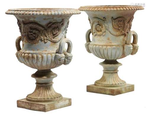 A pair of Victorian painted cast iron garden urns,…