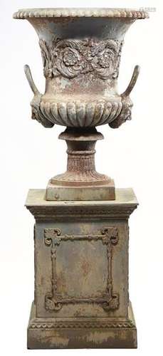 A Victorian painted cast iron garden urn on plinth…