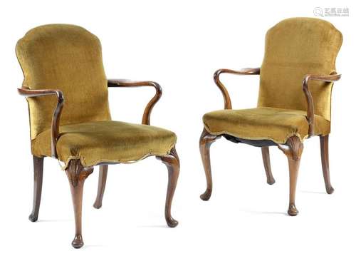 A pair of walnut elbow chairs in George II style, …