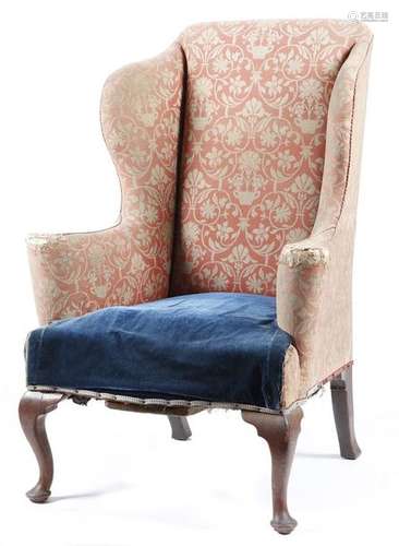 A late Victorian walnut wing armchair in George II…