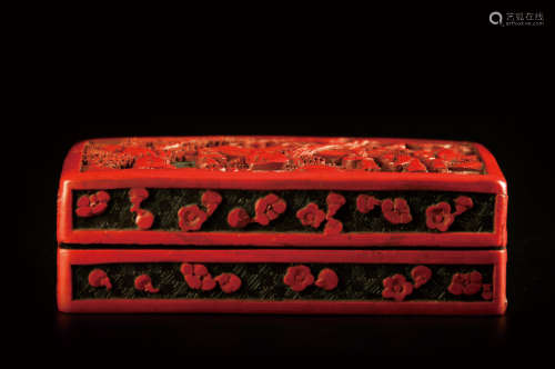 A CARVED CINNABAR BOX