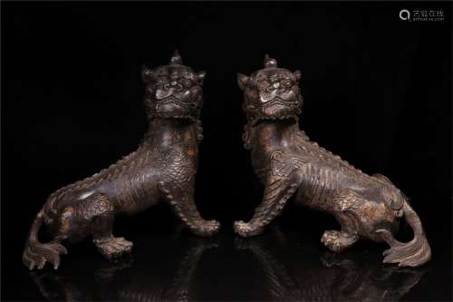 A Pair of Chinese Bronze Foo-Dogs