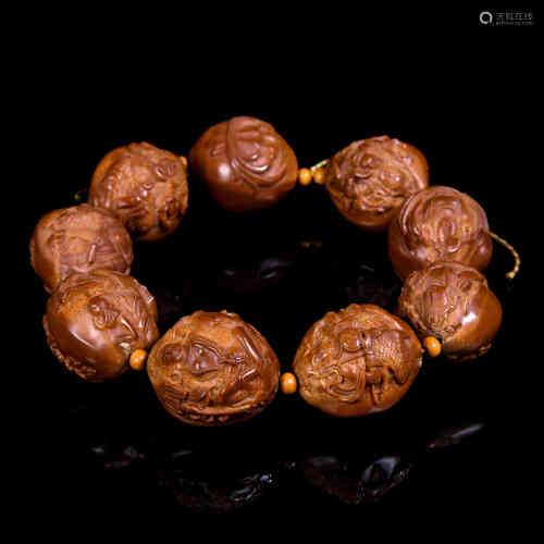 A Chinese Carved Olive Pits Bracelet