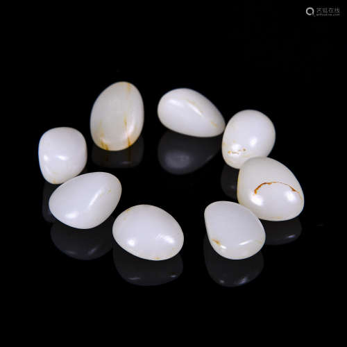 A Group of 8 Chinese Jade Beads