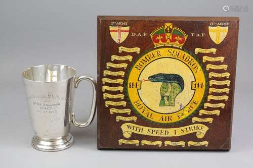 WWII RAF Ephemera, this lot includes a sterling silver tankard belonging to Flying Officer DW Main, 114 Squadron, Birmingham hallmark, dated 1945/6 engraved Flying Officer No 114 Squadron Italy July 8th 1945, approx 314 gms together with a wood carved panel painted with Bomber Squadron 114 emblem of a cobra with various operations from 1939 to 1946