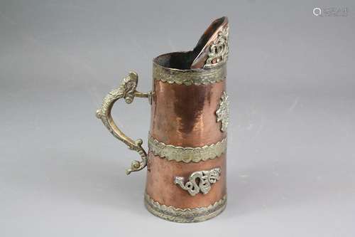 Tibetan copper jug; the jug having dragon handle and decorative bands, approx 17 cms h