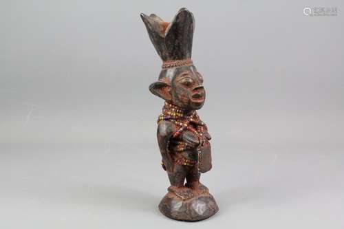 African Yoruba Ibeji carved figure; the beaded figure having a leather amulet, approx 28 cms h